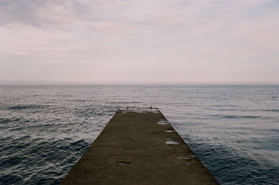 Scenic view of sea against sky at dusk