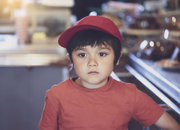 Close-up of boy looking away in cafe