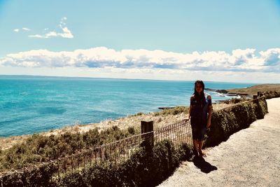 Man looking at sea against sky