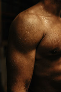 Muscular arm of male athlete with sweat