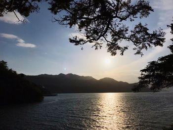 Scenic view of lake against sky during sunset