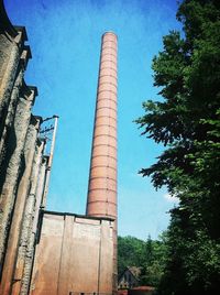 Low angle view of built structure against blue sky