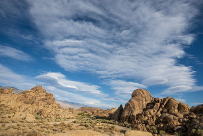 Rock formations in desert against sky