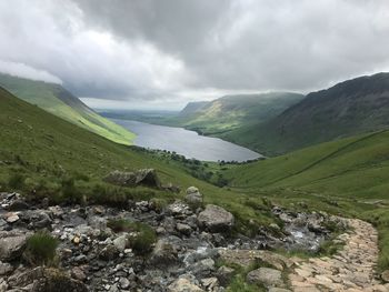 Scenic view of mountains against cloudy sky