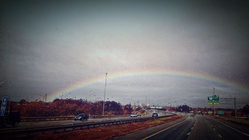 View of illuminated road at night