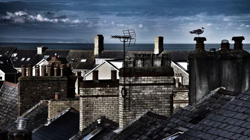 High angle view of buildings in city against sky