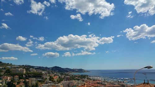 Panoramic view of sea against blue sky