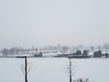 Scenic view of frozen lake against clear sky