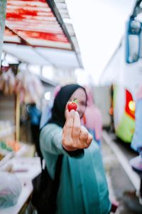 Low section of woman holding food