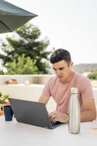 Man looking working on laptop