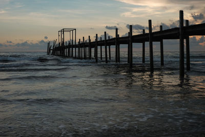 Pier on sea against sky during sunset in kood island, trat, thailand
