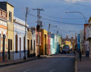 Vehicles on road along buildings