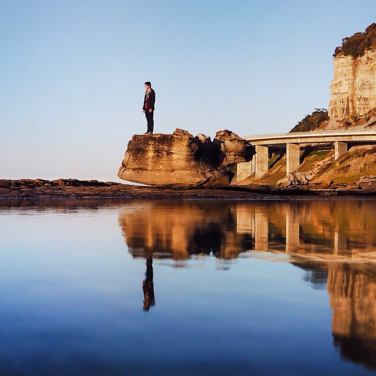 reflection, real people, full length, one person, clear sky, water, day, outdoors, lifestyles, leisure activity, men, sky, standing, architecture, nature, women, young adult, young women, beauty in nature, mammal, people