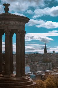 Historic building against cloudy sky