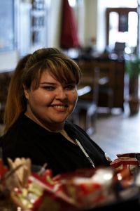 Portrait of smiling woman in cafe