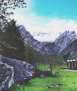 Scenic view of mountains against cloudy sky