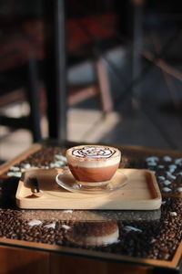 Close-up of coffee cup on table