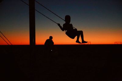 Silhouette of man at sunset