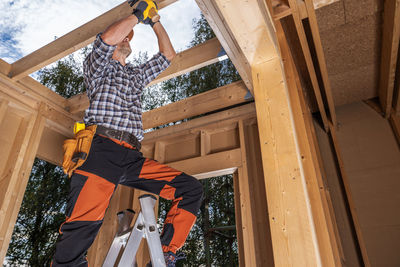 Low angle view of man working at home