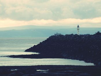 Breakwater lighthouse overlooking welsh coastline