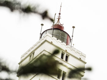 Low angle view of clock tower against sky