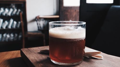 Close-up of beer glass on table