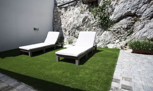 Chairs and tables against wall