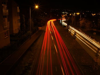 High angle view of light trails on road at night