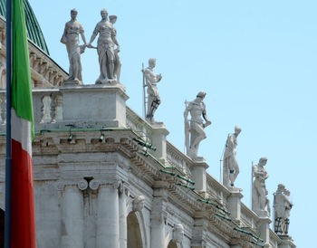 Low angle view of statue against sky