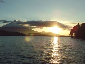 Scenic view of river at sunset