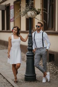 Full length portrait of woman standing outdoors