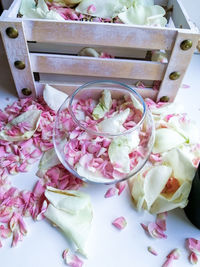 High angle view of pink roses in basket