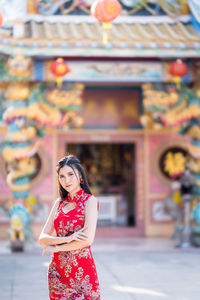 Portrait of woman standing outdoors