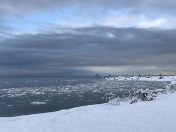 Scenic view of sea against sky during winter