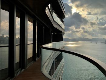 View of swimming pool by sea against sky