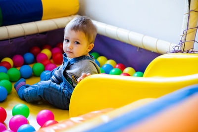 Cute boy playing with toy