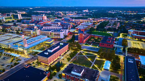 High angle view of illuminated buildings in city at night