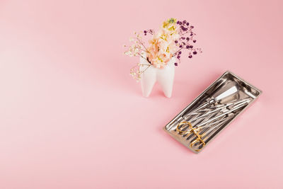 High angle view of beauty products on pink background