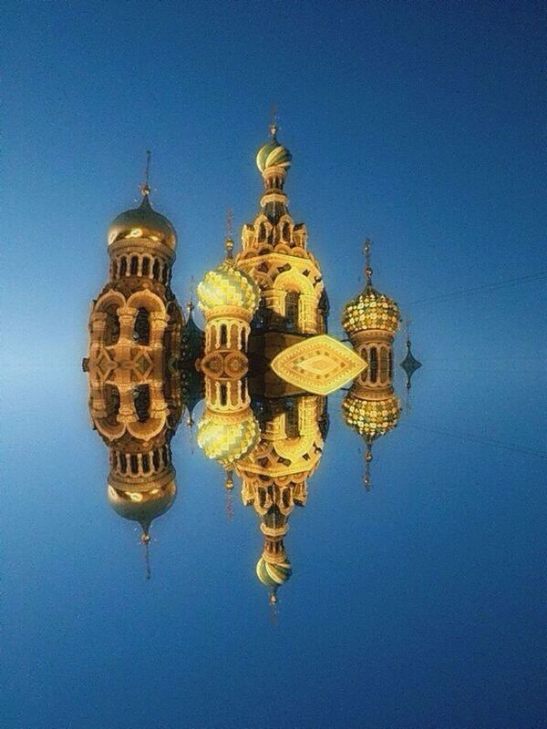 reflection, architecture, built structure, building exterior, religion, spirituality, blue, waterfront, place of worship, symmetry, gold colored, travel destinations, yellow, water, dome, standing water, church, famous place, day, culture, sky, tourism, history