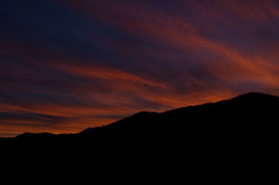 Silhouette mountains against sky during sunset