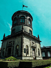 Low angle view of historical building against blue sky