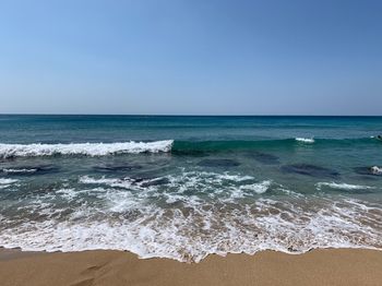 Scenic view of sea against clear sky