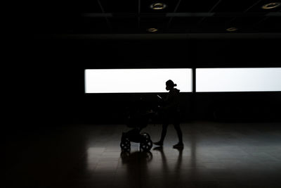 Silhouette people walking on street