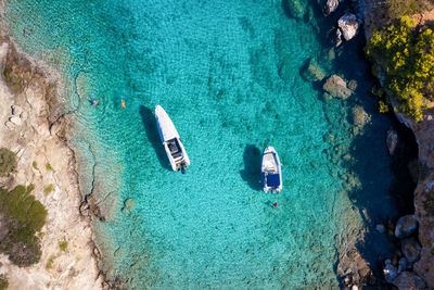 High angle view of people swimming in sea