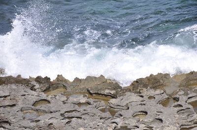 Waves splashing on rocks