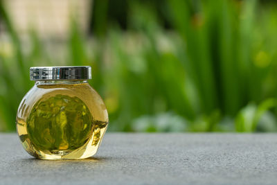 Close-up of glass bottle on table