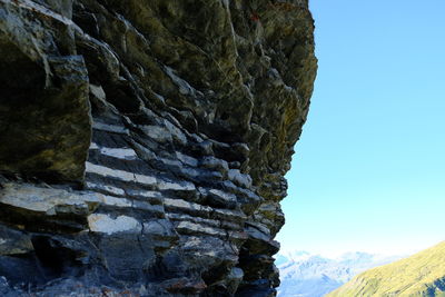 Low angle view of rock formations against sky