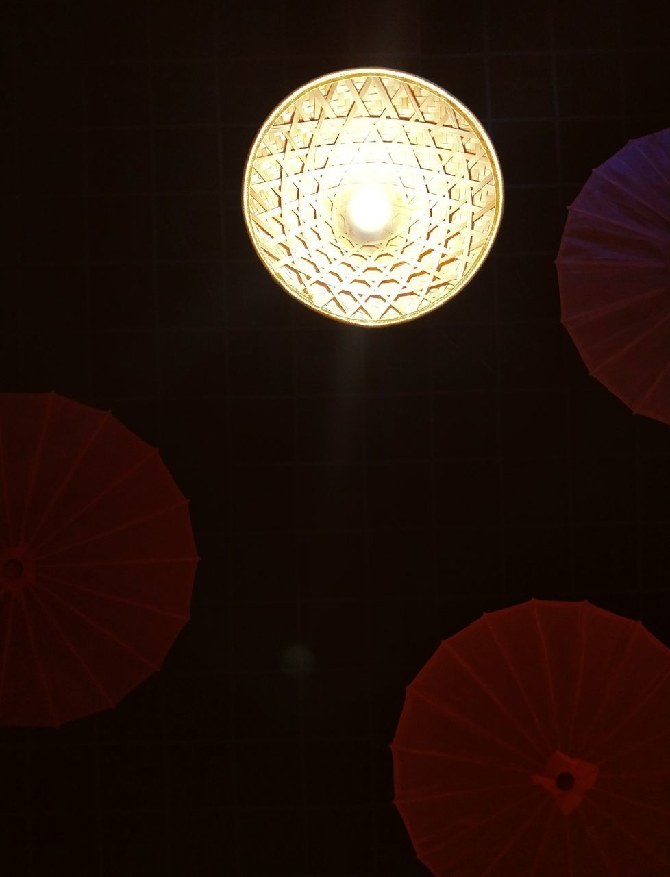 LOW ANGLE VIEW OF ILLUMINATED PENDANT LIGHT HANGING FROM CEILING