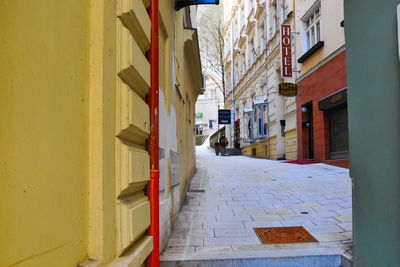 Narrow alley amidst buildings in city