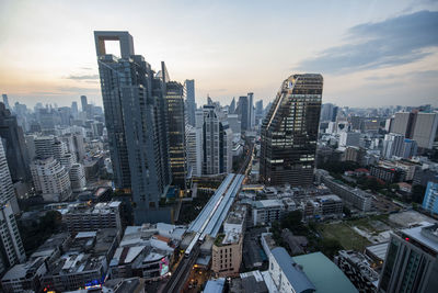 High angle view of buildings in city against sky